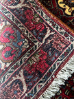 Bidjar Teppich ca. 150 × 100 cm – rot/blau & floral gemustert