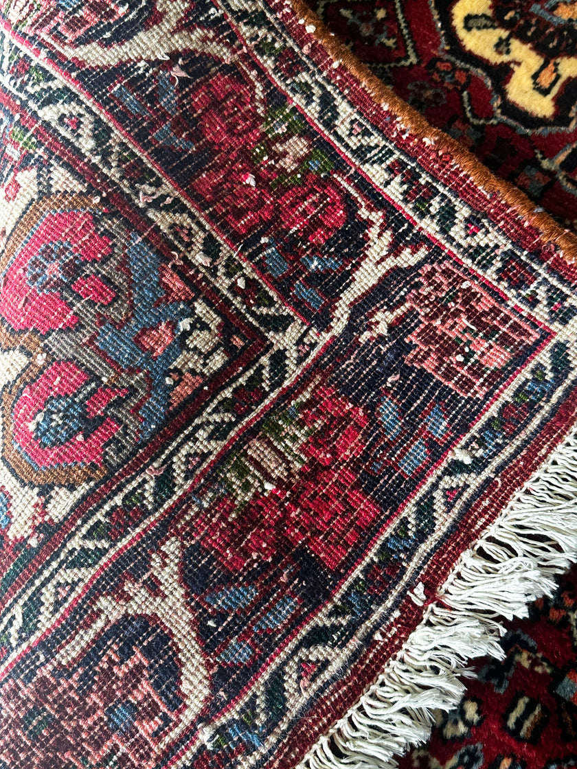 Bidjar Teppich ca. 150 × 100 cm – rot/blau & floral gemustert