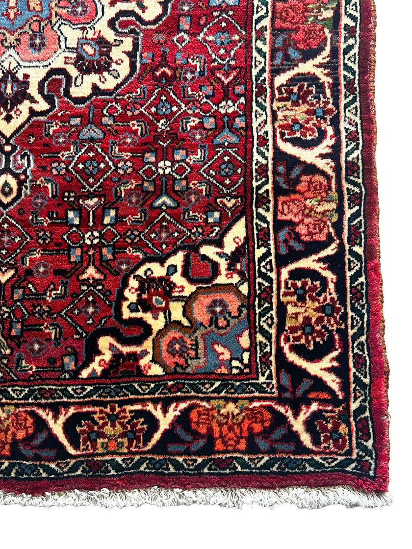 Bidjar Teppich ca. 150 × 100 cm – rot/blau & floral gemustert