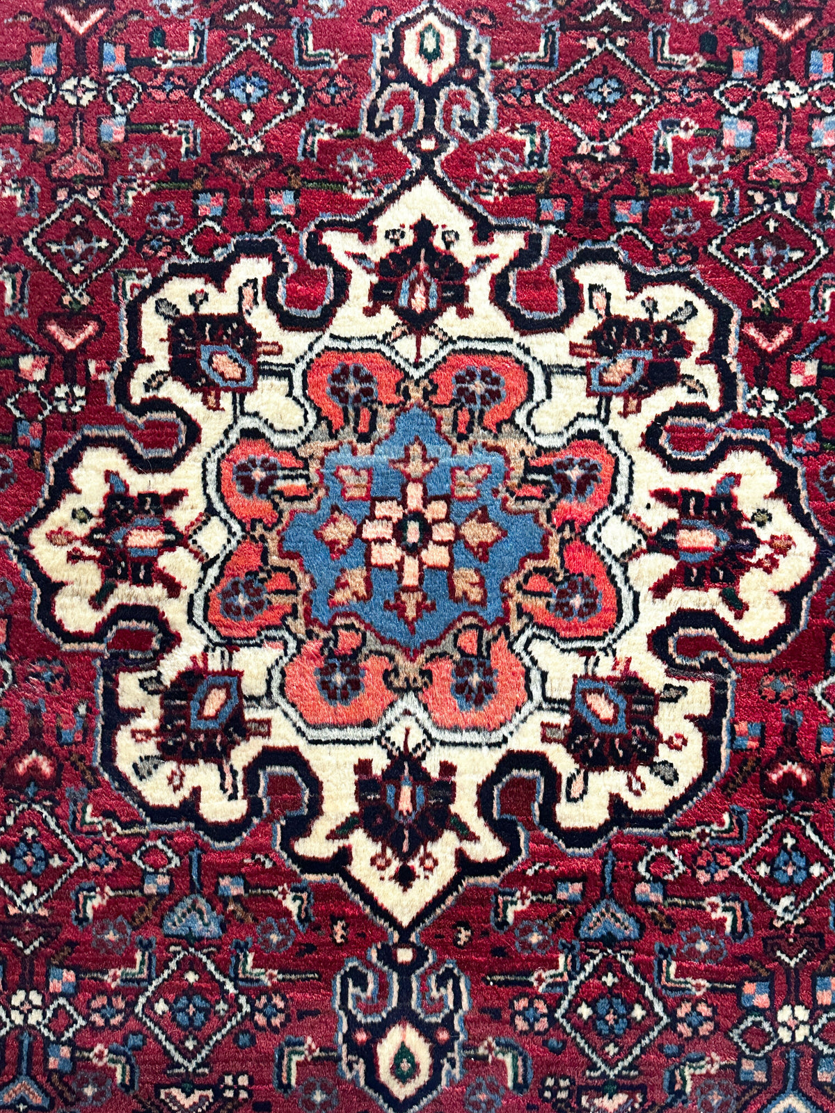 Bidjar Teppich ca. 150 × 100 cm – rot/blau & floral gemustert