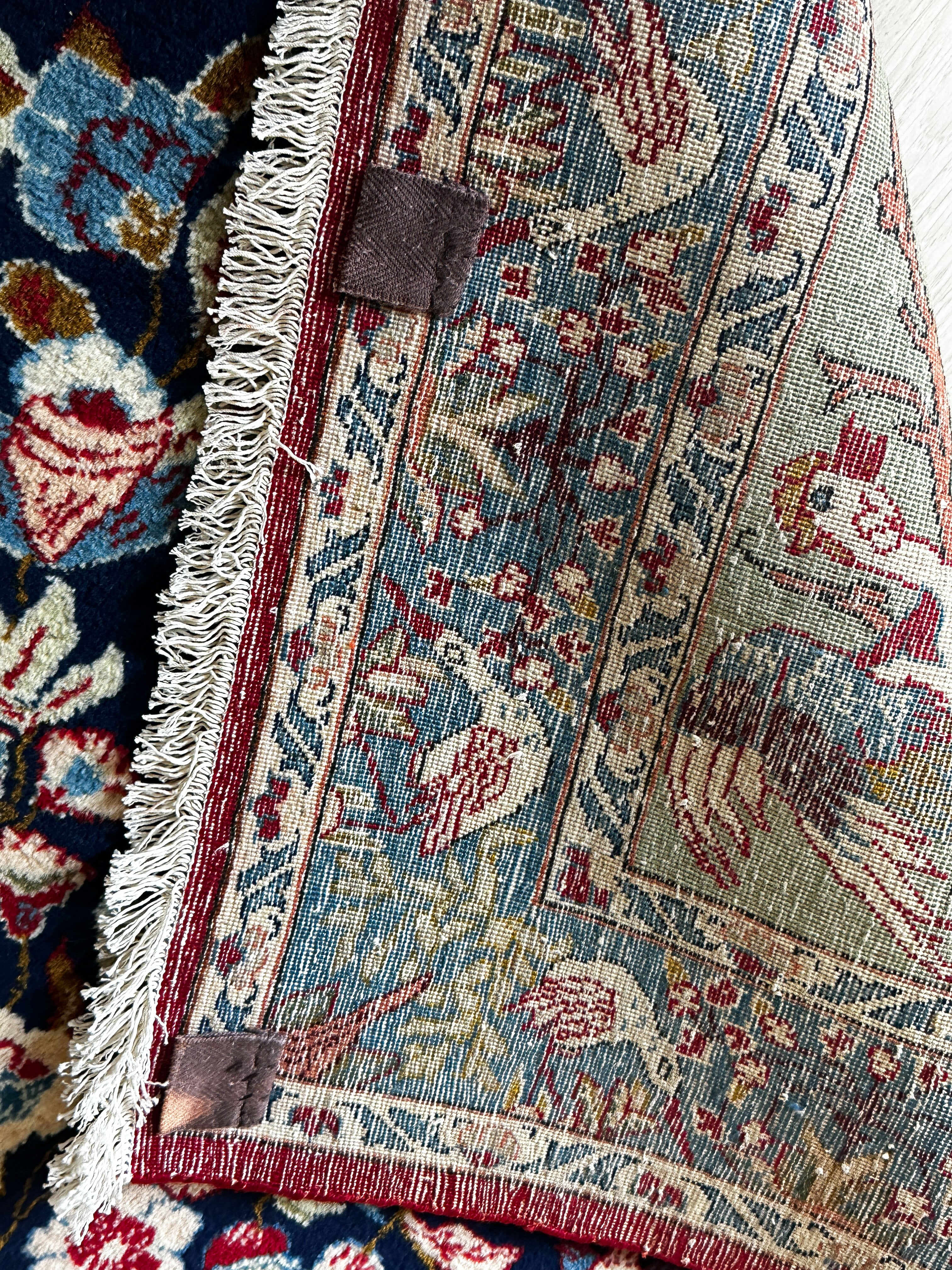 Ghoum Teppich ca. 150 × 100 cm – dunkelblau/rot/blau & floral