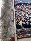 Ghoum Teppich ca. 150 × 100 cm – dunkelblau/rot/blau & floral