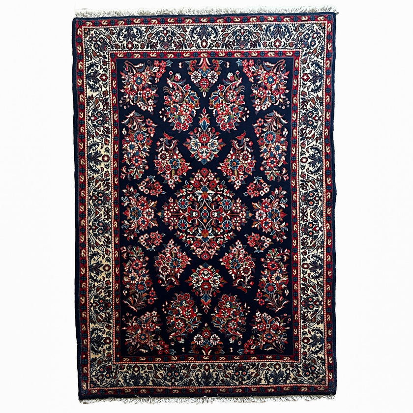 Sarough Teppich ca. 150 × 100 cm – dunkelblau/creme/rot & floral