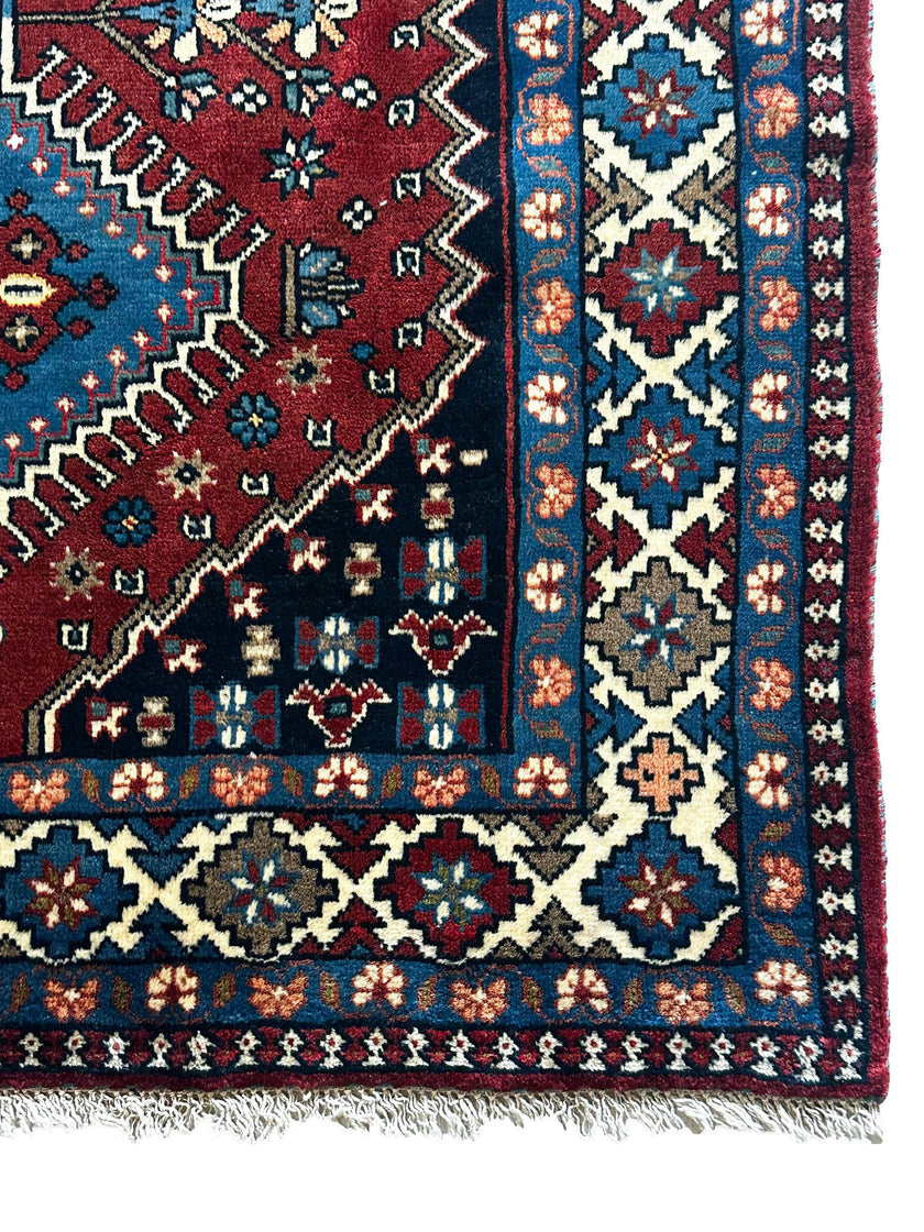 Yalameh Teppich ca. 150 × 100 cm – rot/blau/creme & geometrisch gemustert