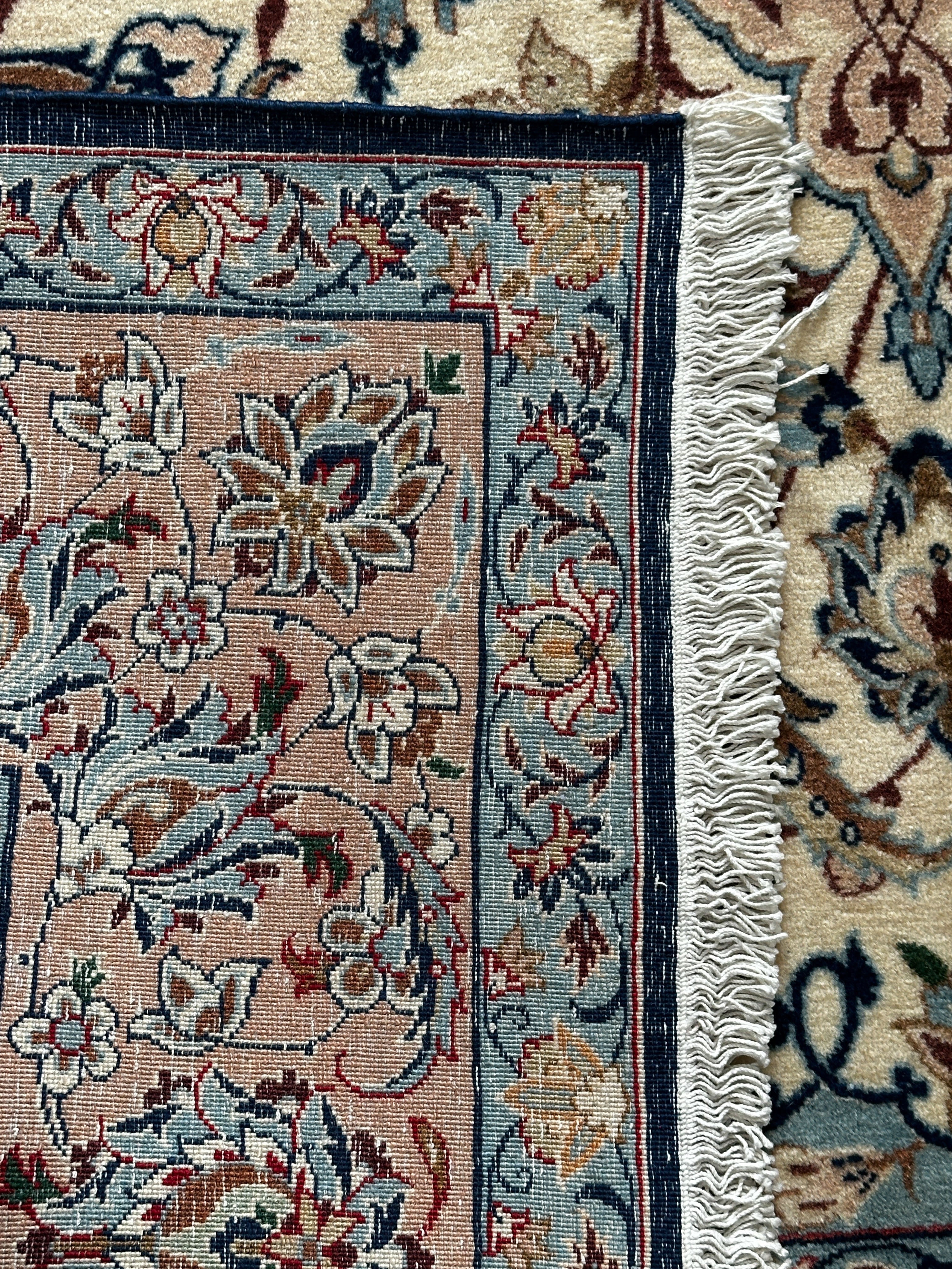 Azad Einrichtungshaus Nadjafabad rug, hand-knotted Persian wool in light blue, beige, and rose with floral pattern. Approx. 250x150 cm.